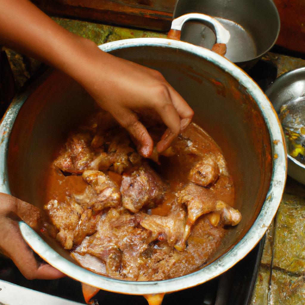 Person cooking Chicken Adobo