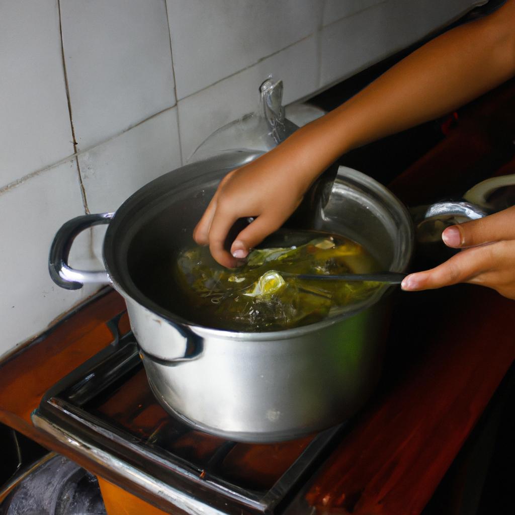 Person cooking Sinigang soup