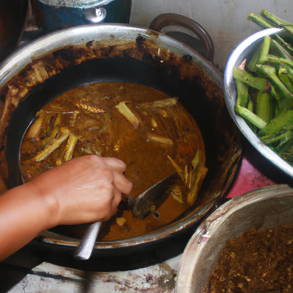 Person cooking Kare-Kare dish