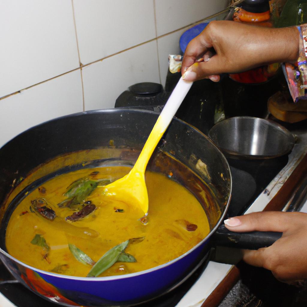 Person cooking tamarind soup